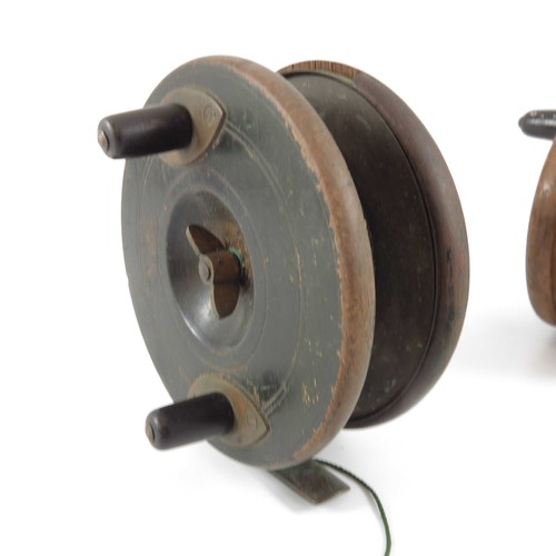 494 - 3 WOODEN FISHING REELS, LARGEST 4.5 ins. AND A WOODEN SPOOL