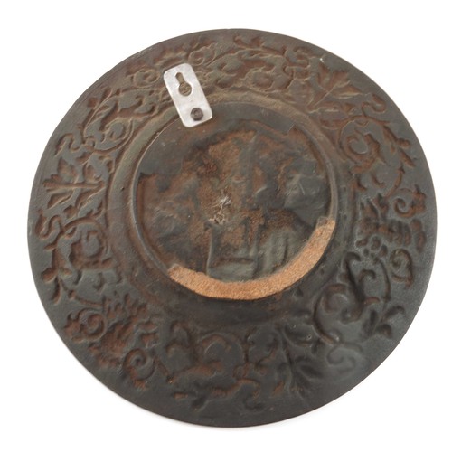 422 - HEAVY CAST METAL WALL PLAQUE WITH RELIEF DECORATION, APPROX. 31.5 cm DIA.