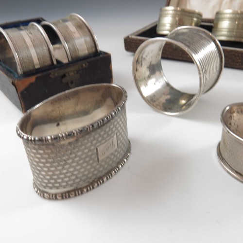 590 - PAIR OF SILVER SERVIETTE RINGS, PAIR OF PLATED DITTO AND 3 OTHER SILVER SERVIETTE RINGS