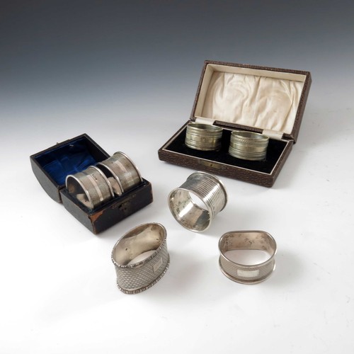 590 - PAIR OF SILVER SERVIETTE RINGS, PAIR OF PLATED DITTO AND 3 OTHER SILVER SERVIETTE RINGS