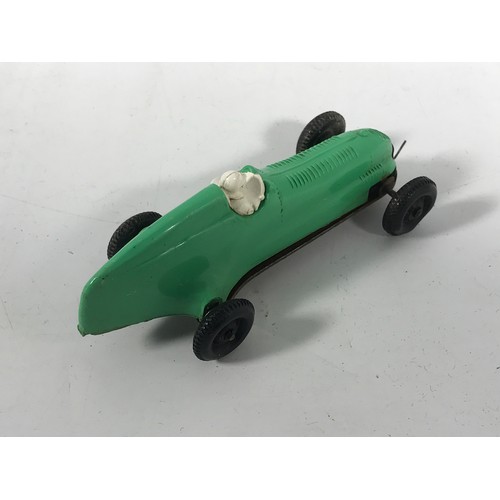 195 - A PENGUIN / FROG EARLY PASTIC RUBBER BAND POWERED CAR, GREEN  COLOURED.