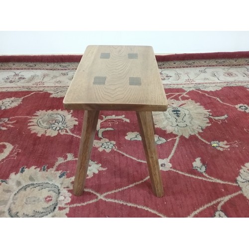 51 - A JOINTED OAK STOOL 37cm wide and  34cm tall