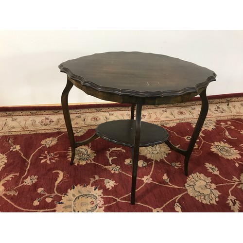 162 - CIRCULAR TOPPED TABLE WITH CARVED LEGS T/W A OVAL SIDE TABLE WITH UNDER TIER