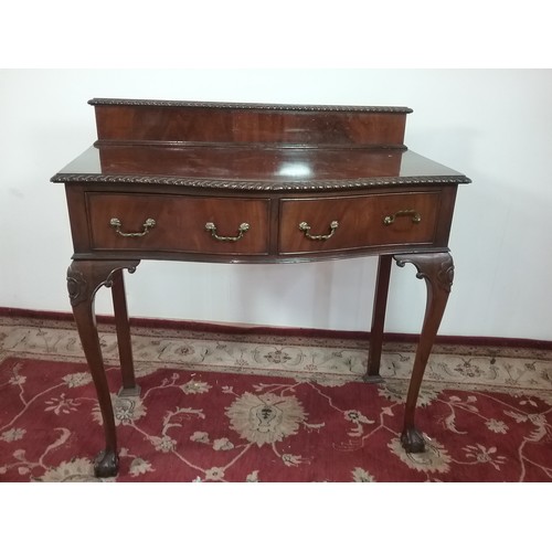 64 - REPRODUCTION MAHOGANY BOW FRONT SIDE TABLE WITH 2 FRIEZE DRAWERS ON CABRIOLE LEGS WITH BALL AND CLAW... 