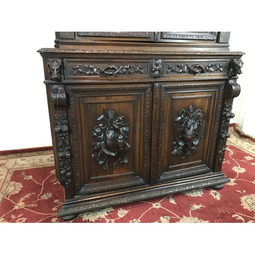 12 - IMPRESSIVE OAK CARVED GOTHIC STYLE GLAZED CORNER CABINET, IN 2 SECTIONS 240CM H 125CM W