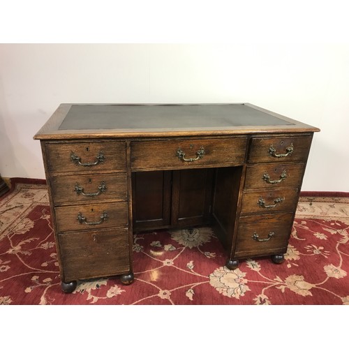 321 - OAK TWIN PEDESTAL DESK WITH TOOLED LEATHER TOP 121cm wide and 79cm tall