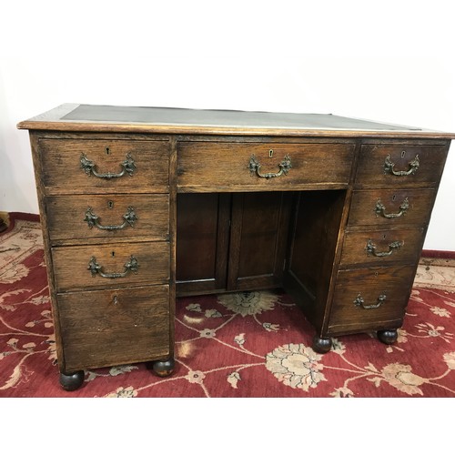 321 - OAK TWIN PEDESTAL DESK WITH TOOLED LEATHER TOP 121cm wide and 79cm tall