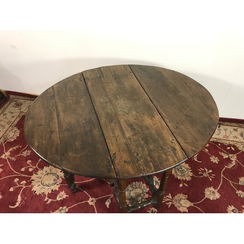 332 - GATE LEG OVAL TOP DINING TABLE 114cm wide and  72cm tall