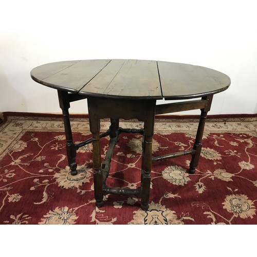 332 - GATE LEG OVAL TOP DINING TABLE 114cm wide and  72cm tall