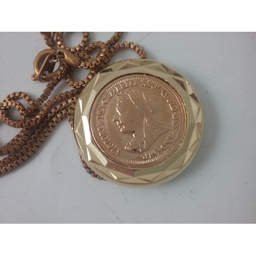 719 - LOCKET CONTAINING WHAT APPEARS TO BE A VICTORIAN HALF SOVEREIGN