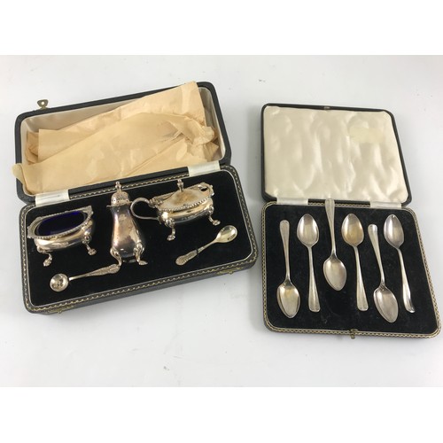 576 - CASED SILVER CRUET SET AND A CASED SET OF 6 SILVER TEASPOONS 210g