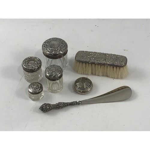 585 - 4 SILVER TOPPED DRESSING TABLE BOTTLES, A PILL BOX WITH HINGED TOP, SILVER BACK BRUSH AND A SILVER H... 