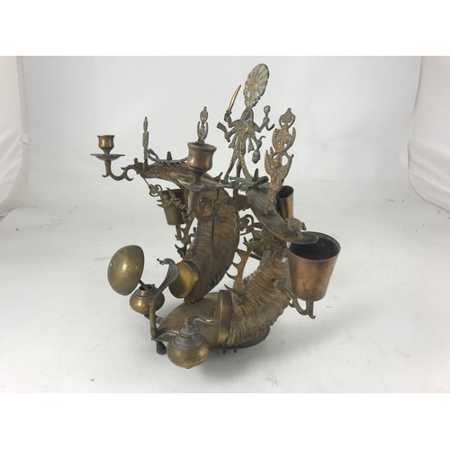 475 - AN UNUSUAL ANGLO INDIAN BRASS AND RAMS HORN DESK STAND WITH INK WELLS, SERVANTS BELLS, CANDLESTICKS ... 