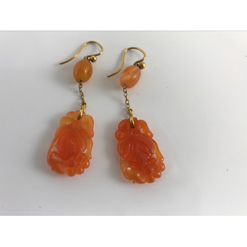 804 - PAIR OF AMBER COLOURED JADE CARVED EARRINGS