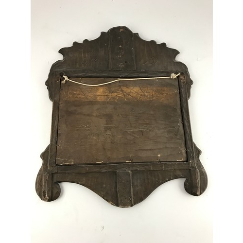 84 - WALNUT FRAMED MIRROR INSCRIBED VERSO JM 1731 APPROX. 46 X 55 cm