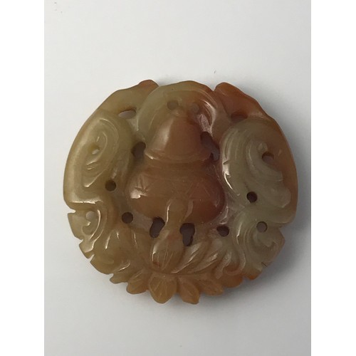 803 - ROUND PIERCED JADE CARVING/PENDENT APPROX. 4.5 cms DIAMETER