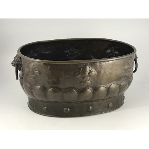 419 - IMPRESSIVE EMBOSSED BRASS WINE COOLER, 19TH CENTURY, HAVING TWIN LION MASK HANDLES, APPROX. 60 cm WI... 