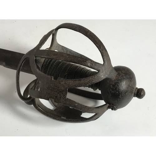 266 - POSSIBLY LATE 17TH CENTURY, SCOTTISH, BASKET HILTED SWORD HAVING SINGLE EDGE BLADE INDISTINCTLY STAM... 