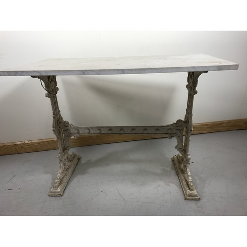 115 - MARBLE TOPPED TABLE ON CAST IRON BASE