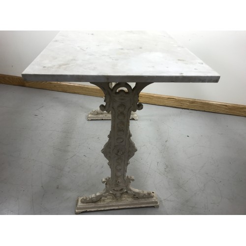 115 - MARBLE TOPPED TABLE ON CAST IRON BASE