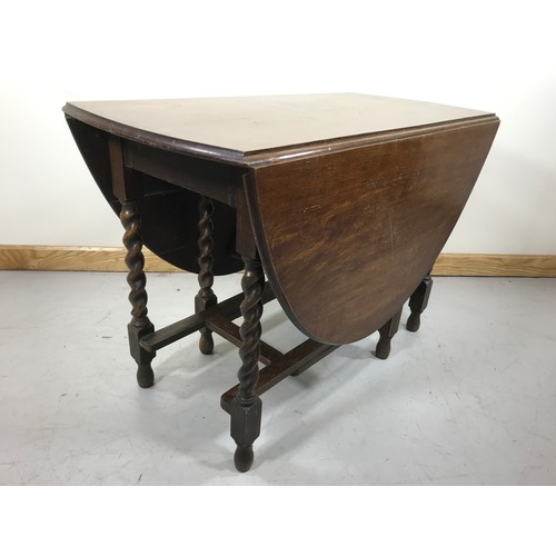 58 - OAK DROP LEAF DINING TABLE WITH BARLEY TWIST LEGS 151cm long