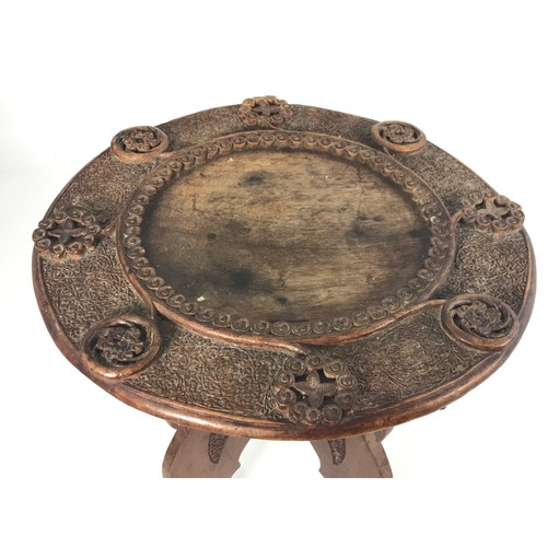 92 - ROUND TOP CARVED INDIAN TABLE