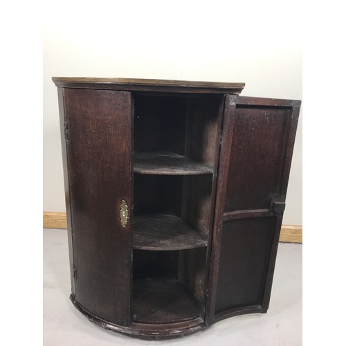 84 - GEORGIAN MAHOGANY BOW FRONT HANGING CORNER CUPBOARD 86cm TALL