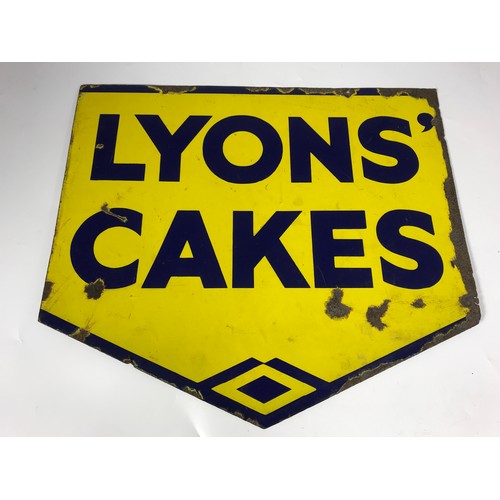 9 - ENAMEL ADVERTISING SIGN, LYONS' CAKES BEING YELLOW WITH BLUE WRITING APPROX 17.5 INCH BY MAXIMUM OF ... 