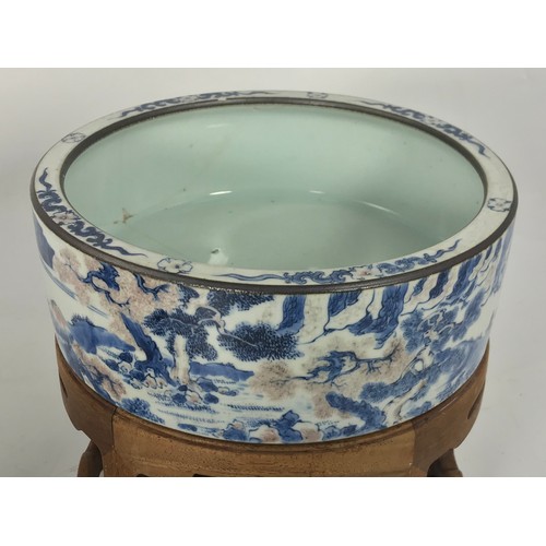 318 - PAIR OF ORIENTAL BLUE AND WHITE STRAIGHT SIDED CIRCULAR BOWLS EACH APPROX. 22 cms DIAMETER WITH HARD... 