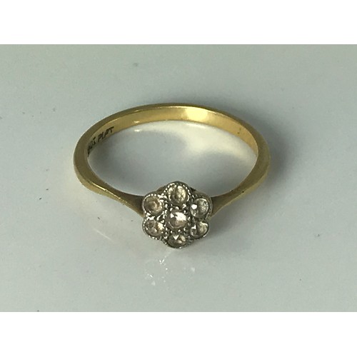 783 - 18 CARAT GOLD DAISY SET DIAMOND RING