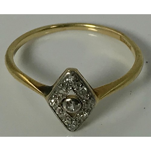 786 - ART DECO STYLE DIAMOND RING WITH LOZENGE SET STONES ON AN 18 CARAT GOLD BAND