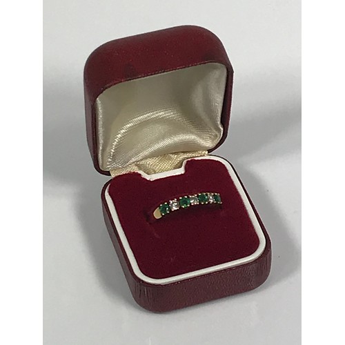 784 - 18 CARAT GOLD EMERALD AND DIAMOND RING