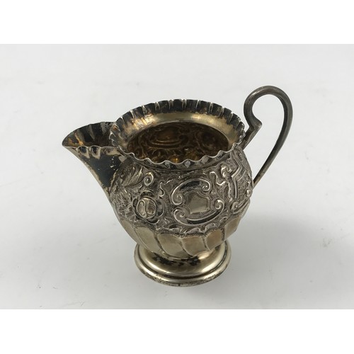 612 - SMALL EMBOSSED SILVER CREAM JUG 50g