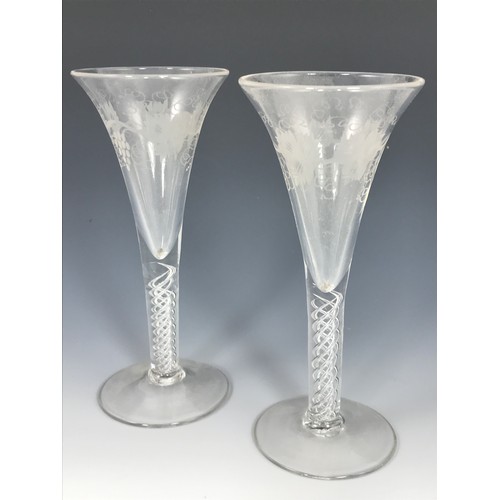 375 - PAIR OF GEORGIAN TRUMPET WINE GLASSES WITH AIR TWIST STEMS ENGRAVED GRAPE AND VINE DECORATION APPROX... 