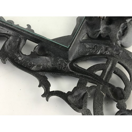 427 - PAIR OF CAST IRON PICTURE FRAMES WITH FIGURAL DECORATION, approx. 33 x 24 cm