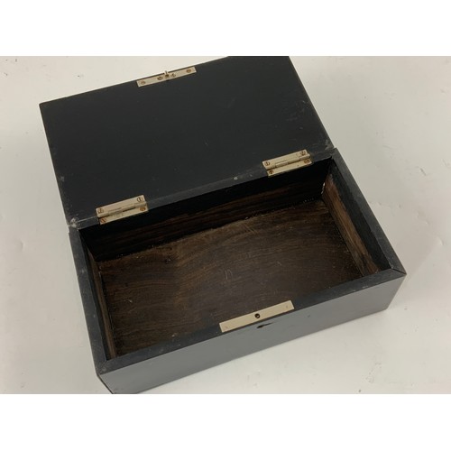 495 - EBONISED RECTANGULAR CIGARETTE BOX WITH HINGED LID AND ORNATE SILVER CORNER MOUNTS AND LETTERING