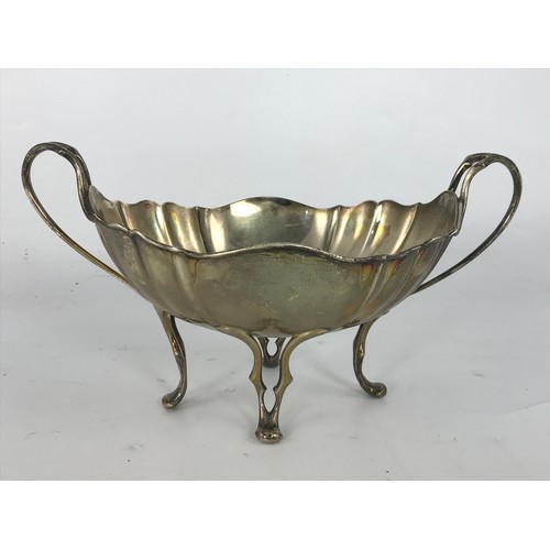 627 - STYLISH TWO HANDLED SILVER BOWL ON FOUR FEET, 450G.