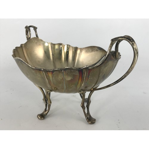 627 - STYLISH TWO HANDLED SILVER BOWL ON FOUR FEET, 450G.