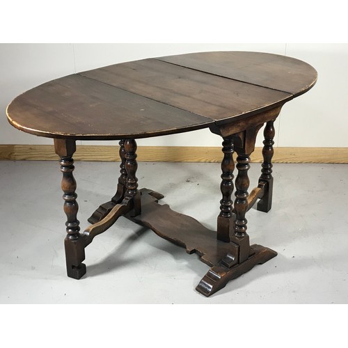 1067 - OAK GATE LEG OVAL TOP DINING TABLE