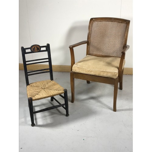 1062 - EBONISED CANE SEATED CHILDS CHAIR TOGETHER WITH CANE SEATED ELBOW CHAIR