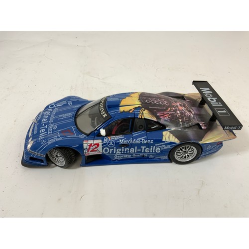 328 - 3 UNBOXED MODELS MAISTO PLINTHED PORSCHE 911 GT1, LA MANS (1998) PLUS A MAISTO MERCEDES CLK-GTR UNBO... 