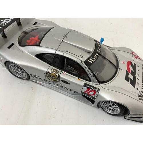 328 - 3 UNBOXED MODELS MAISTO PLINTHED PORSCHE 911 GT1, LA MANS (1998) PLUS A MAISTO MERCEDES CLK-GTR UNBO... 