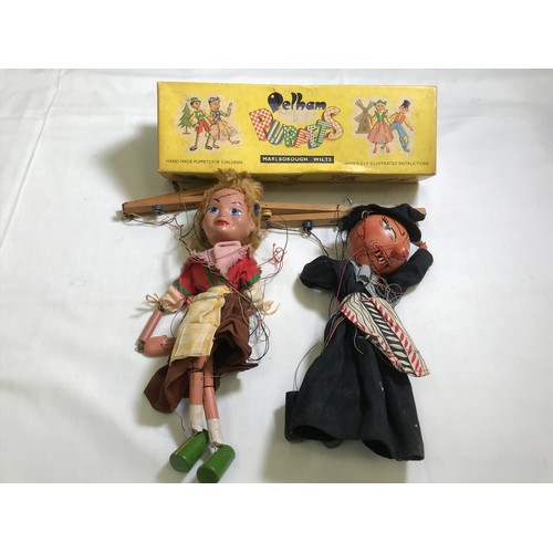 195 - 2 PELHAM PUPPETS WITCH IN A JIMMY CRICKET BOX, A YOUNG GIRL AND 2 VINTAGE DOLLS