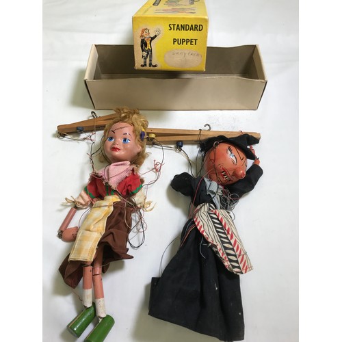 195 - 2 PELHAM PUPPETS WITCH IN A JIMMY CRICKET BOX, A YOUNG GIRL AND 2 VINTAGE DOLLS