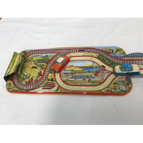 161 - TIN PLATE DBGM MADE IN WESTERN GERMANY CLOCKWORK ROAD AND TRAM TOY WITH 2 CARS AND TRAM RUNNING FROM... 