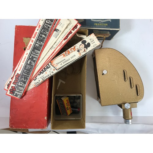 164 - STRIP MASTER FILM PROJECTOR FOR 35MM STRIP TOGETHER WITH A NUMBER OF CINE STRIPS THE ADVENTURES OF D... 