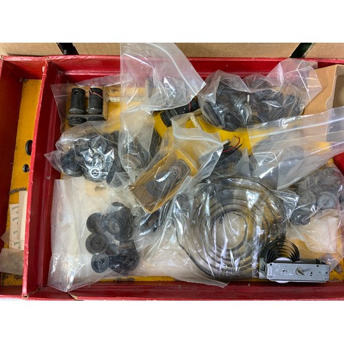 381 - A TRAY OF VARIOUS WHEELS, SPRINGS, MOTORS AND CURIOUS MAINLY FOR HORNBY AND SIMILAR O GAUGE MODELS T... 