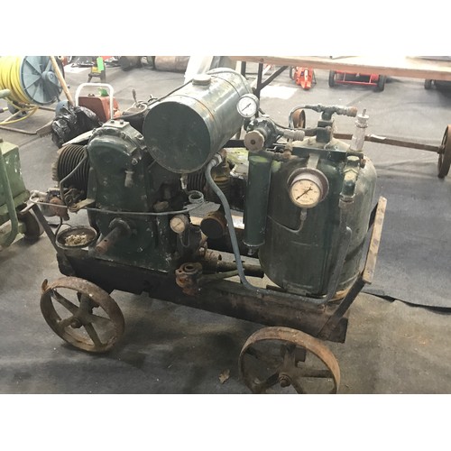 598 - A UNIVERSAL 2 STROKE PETROL ENGINE PETTER WITH COMPRESSOR ON TROLLEY NOTE THERE IS A TWIN CYLINDER F... 