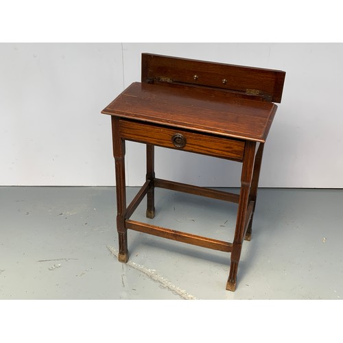 205 - UNUSUAL OAK DESK WITH CONCEALED COMPARTMENT HAVING INKWELLS AND A FRIEZE DRAWER