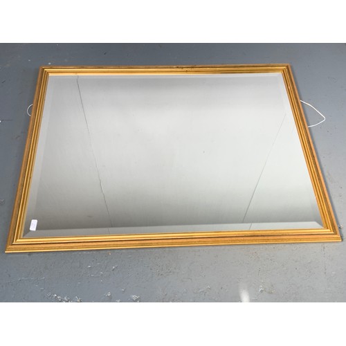 70 - BEVELLED OVER MANTLE MIRROR WITH GILT FRAME